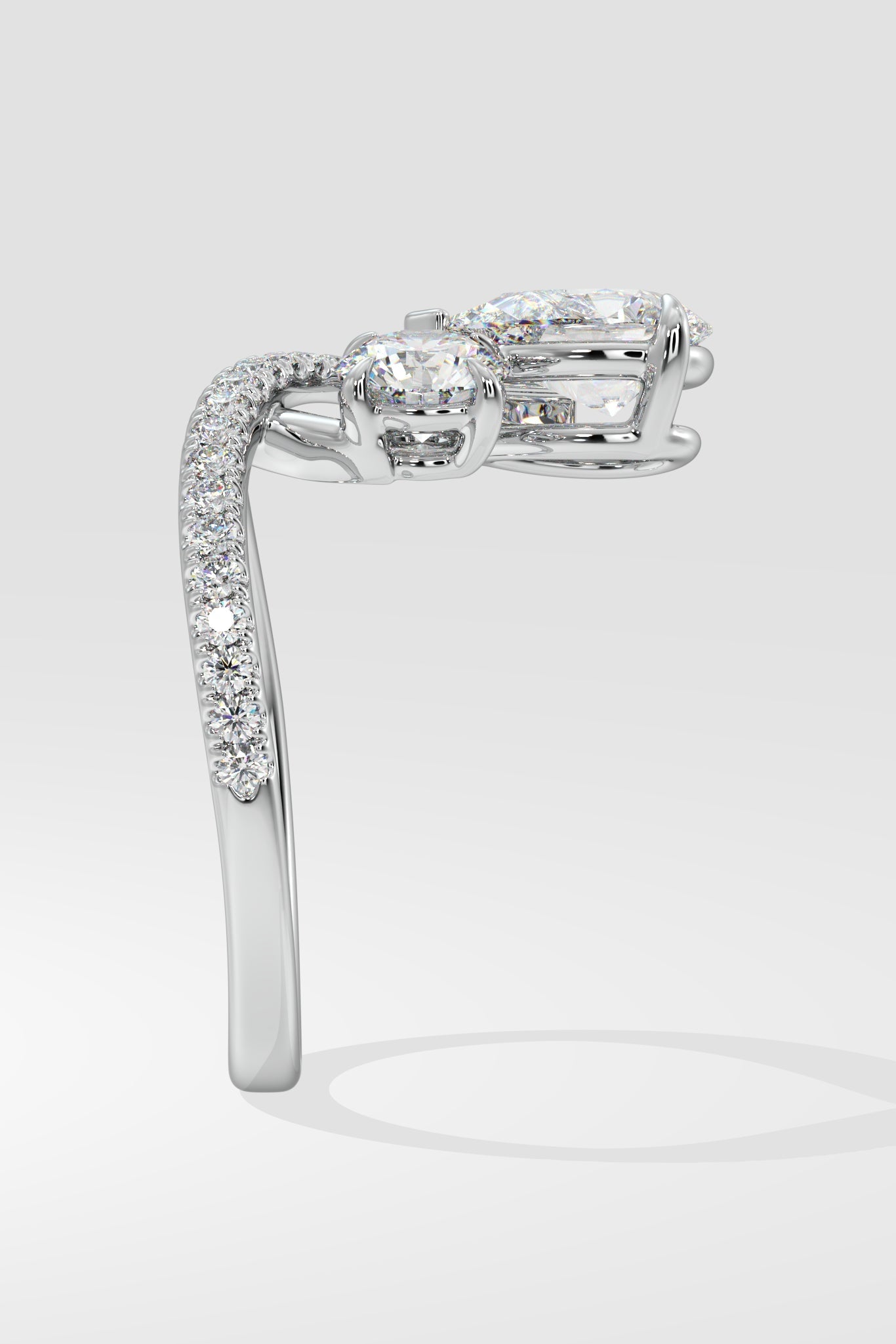 Two Stone Pear & Round Ring
